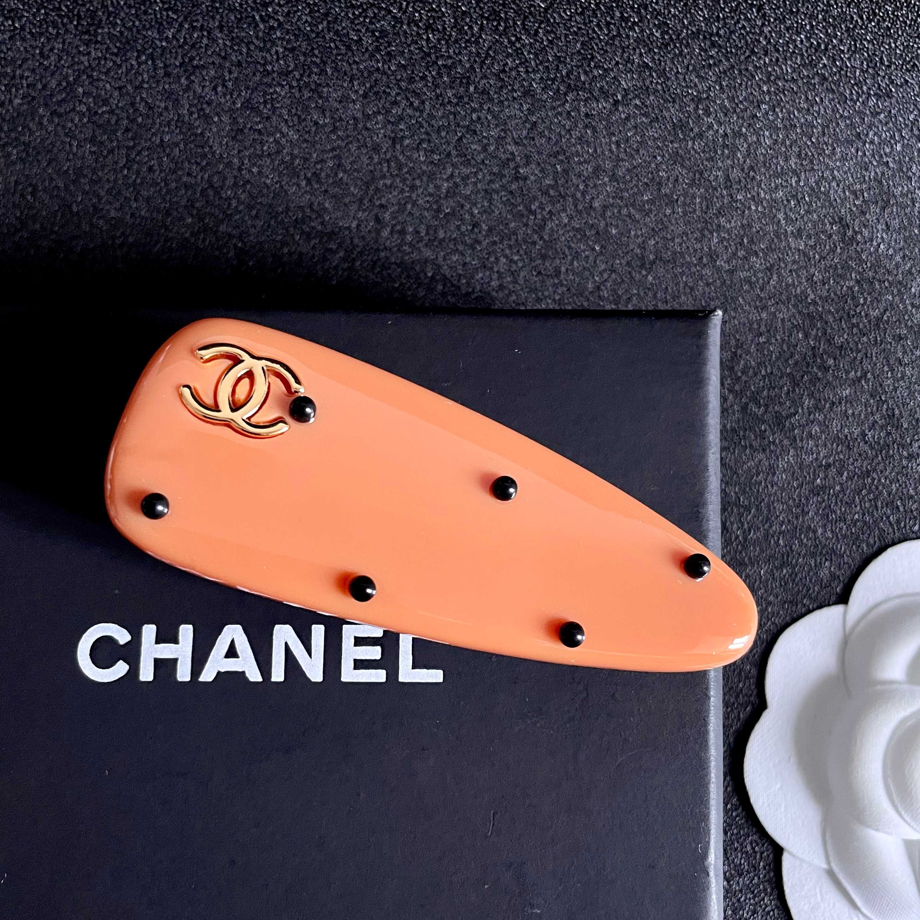 Chanel Orange Hair Clip with Black Dots